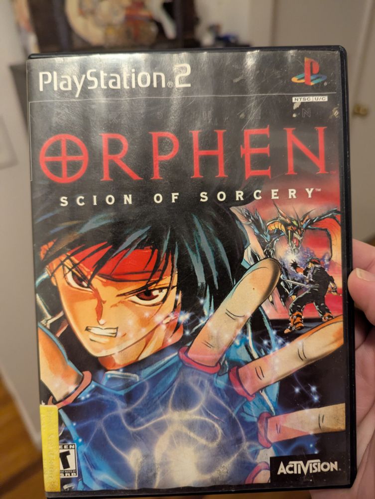 A water damaged copy of Orphen: Scion of Sorcery. It sucks.
