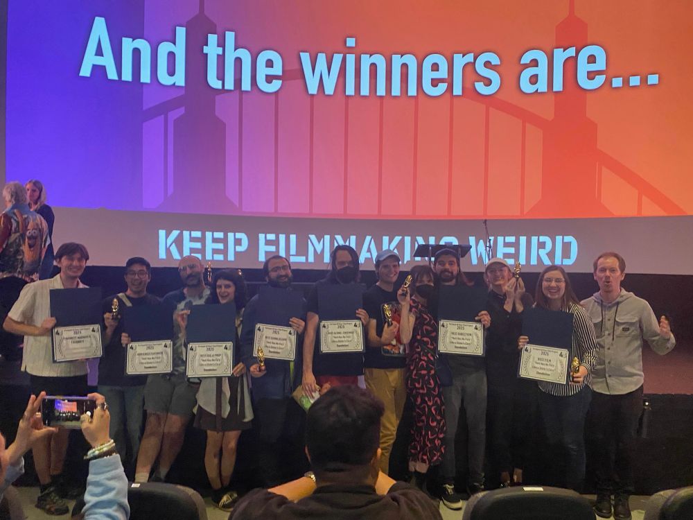 Our team posing with our many awards, including audience favorite and best in show