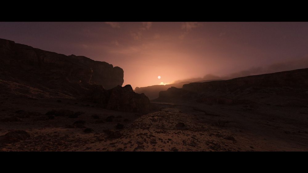 A screenshot from the videogame Star Wars: Outlaws. A rocky desert region, with cliffs flanking the left and right side of the shot. In the foreground, flat but uneven terrain. In the distance, twin suns set between the cliffs, flaring the sky with a fading orange purple glow.