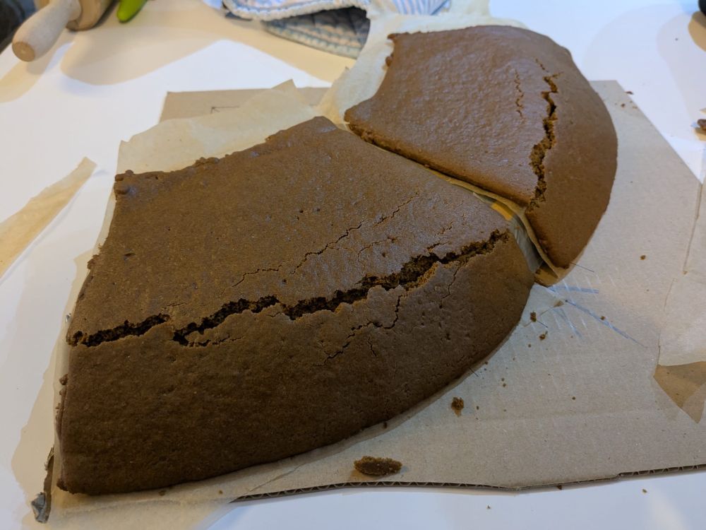 Gingerbread attempting to be bent over a curve that is cracking. 