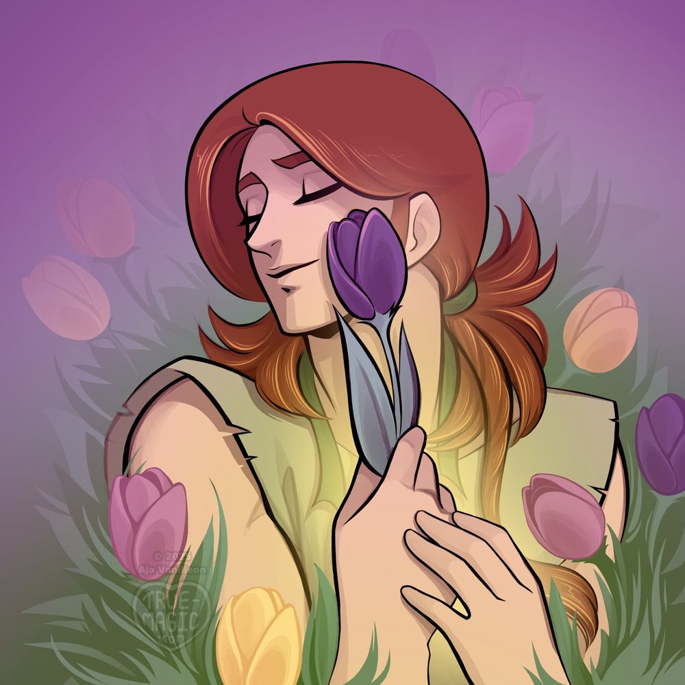 Henson lies in the grass with a contented smile, surrounded by tulips.