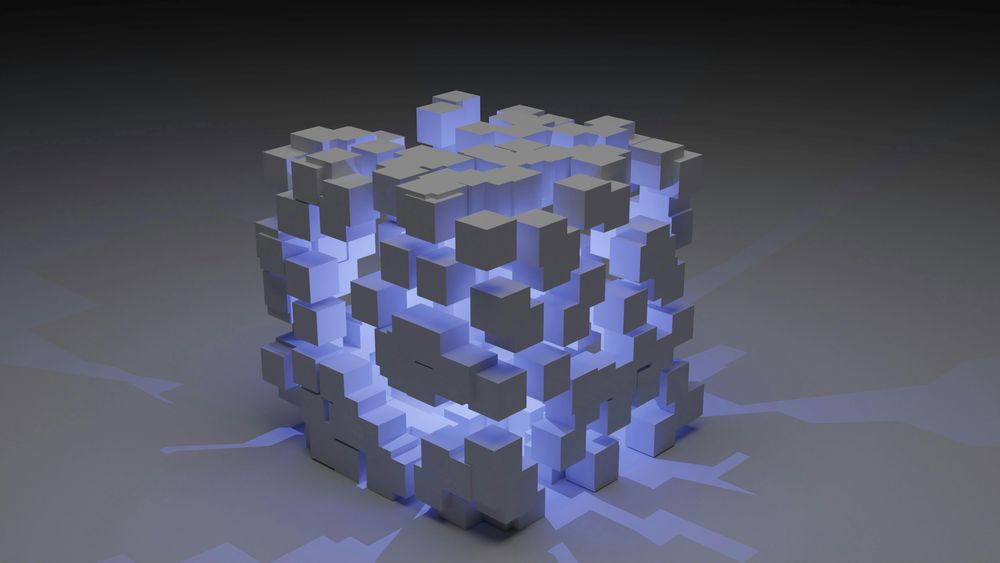 3D illustration of blocks in a cubical box with blue light inside it.