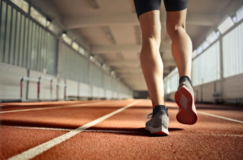 Athlete training on a running track.
