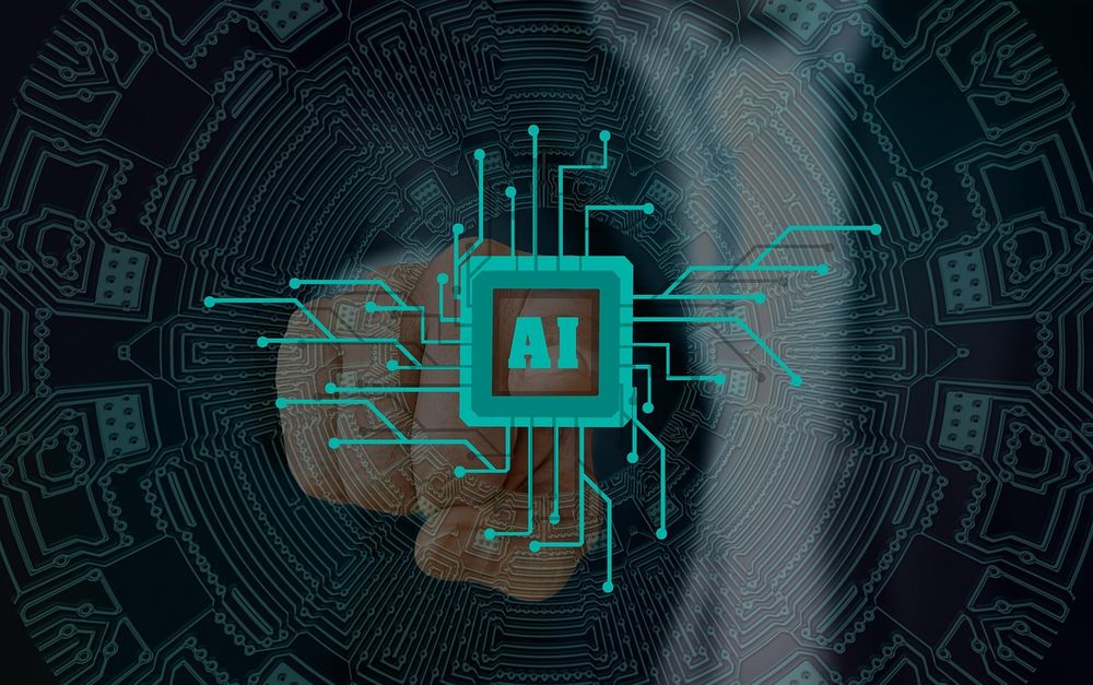 This image shows the word AI with a hand touching it.