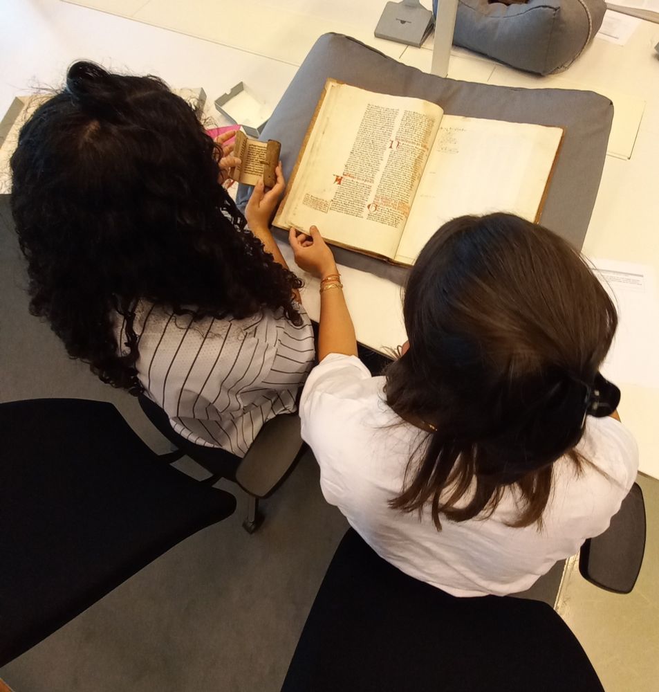 Two students working with manuscripts