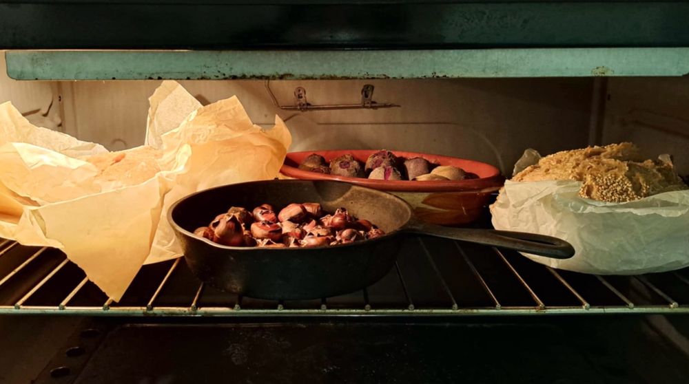 Winter food in oven: chestnuts, bread, beets and eggplants roasting...