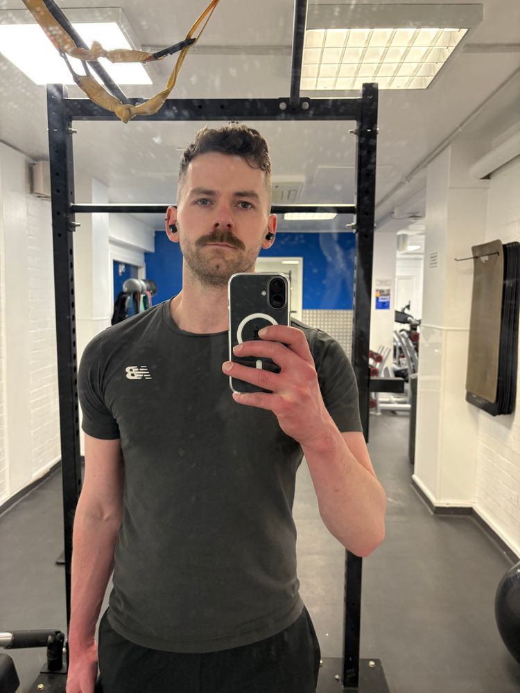 Selfie of Patrick in the gym, the mirror is FILTHY 