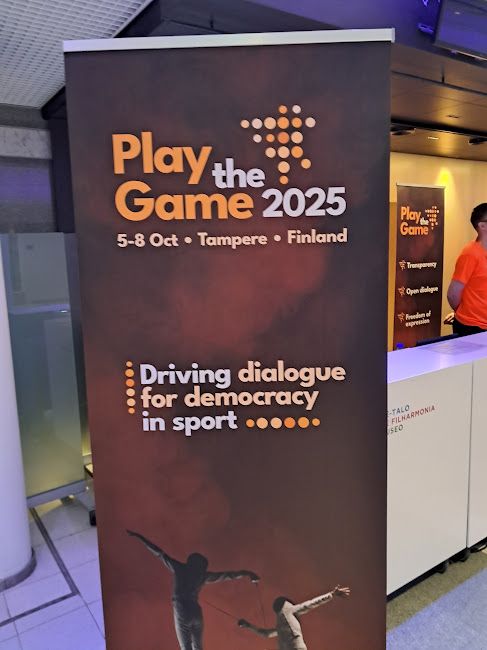 A board at the conference with the title