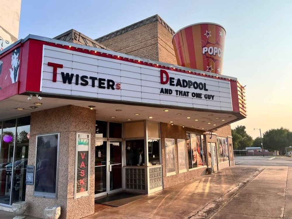 Photo of an old-style theatre marquee stating "Twisters" and "Deadpool and That One Guy".