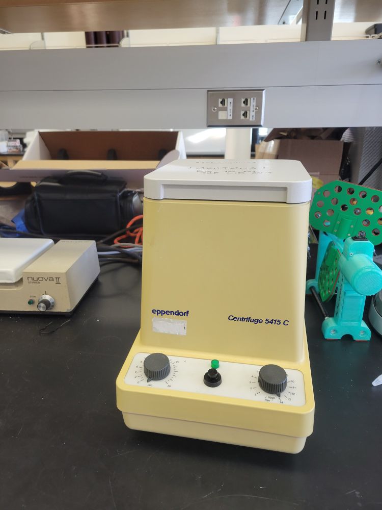 An eppendorf centrifuge in that specific nicotine-yellow color from the 80s. It's the exact color as the old fridge in your garage that you keep sodas in that your parents replaced in 1997, and which has outlived a half-dozen of its replacements.