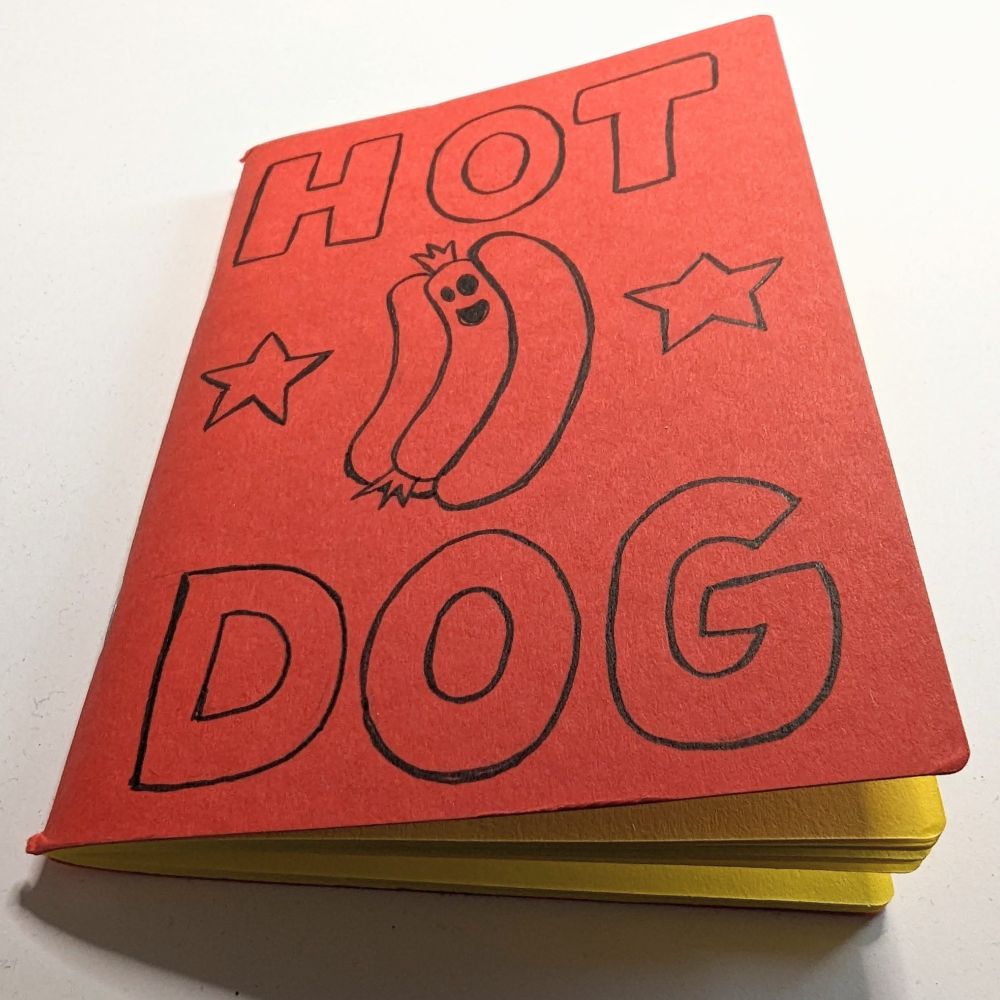 A sketchbook of a cartoon hotdog.