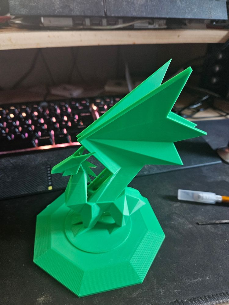 A green 3D Printed model of a crystalline dragon standing on a plinth.
Model source: Ripped from Spyro the Dragon (PS1) 1998 © Insomniac Games