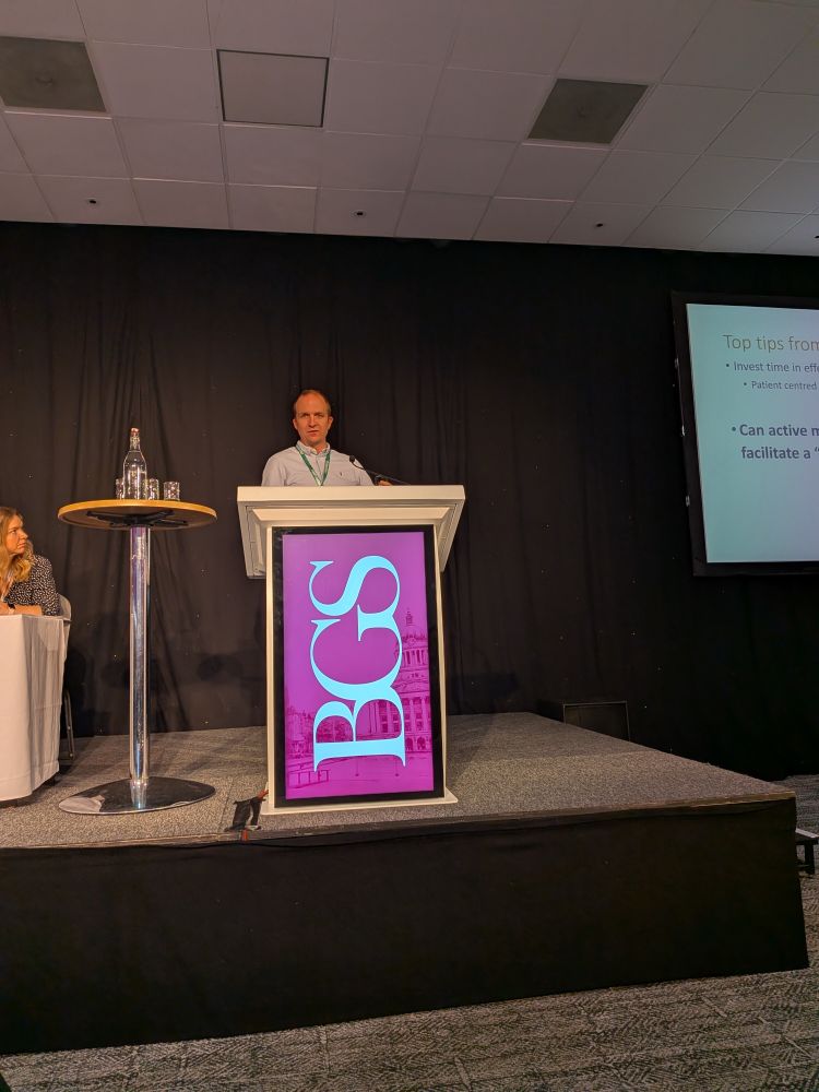 Dr Nick Saxton standing at a BGS lectern.