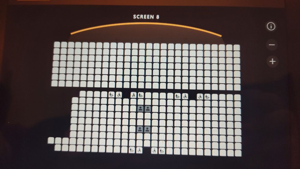 A map of a cinema salon showing available seats. All seats are sold except four in the middle 
