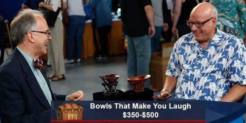 Appraiser and man both laughing, looking at some weird bowls. Caption: bowls that make you laugh $350-$500