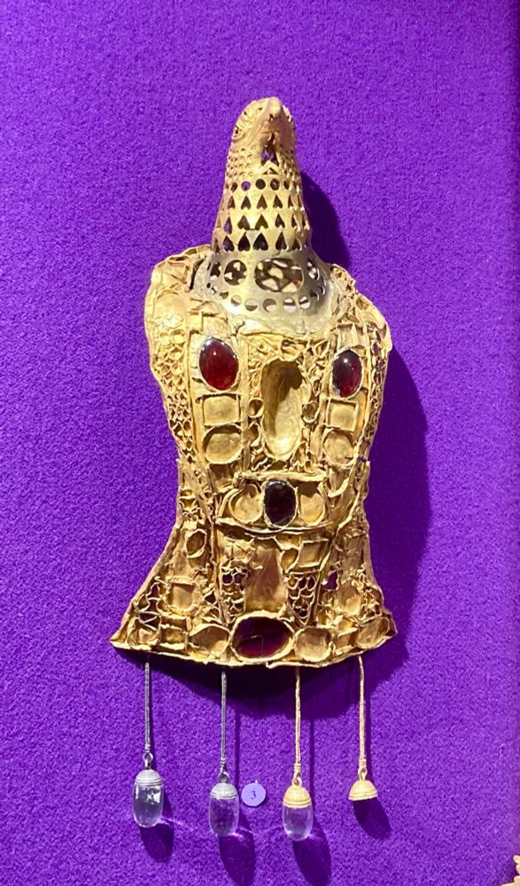 The “imperial brooch” from Pietroasa. It is a large golden eagle with garnet inlay (though most garnets are missing) and 4 pendilia