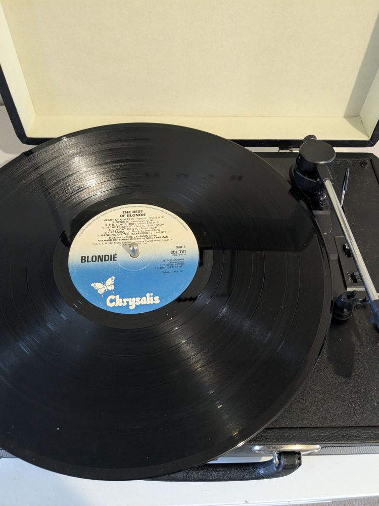 The Best Of Blondie vinyl on a portable turntable ready to be played.
