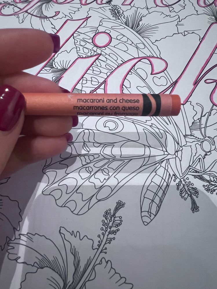 A crayola crayon in the colour macaroni and cheese