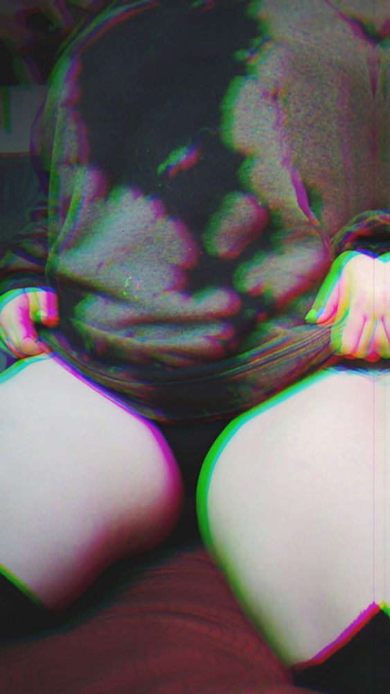 a neck down RGB filtered image of a pale femme in an oversized sweater and black thigh high socks kneeling on a bed and slowly pulling up their sweater to show off their thick delicious thighs. 
between their  legs is still shadowed and obscured, but tantalizingly close. 

🖤🧡
#alt #milf #bbw