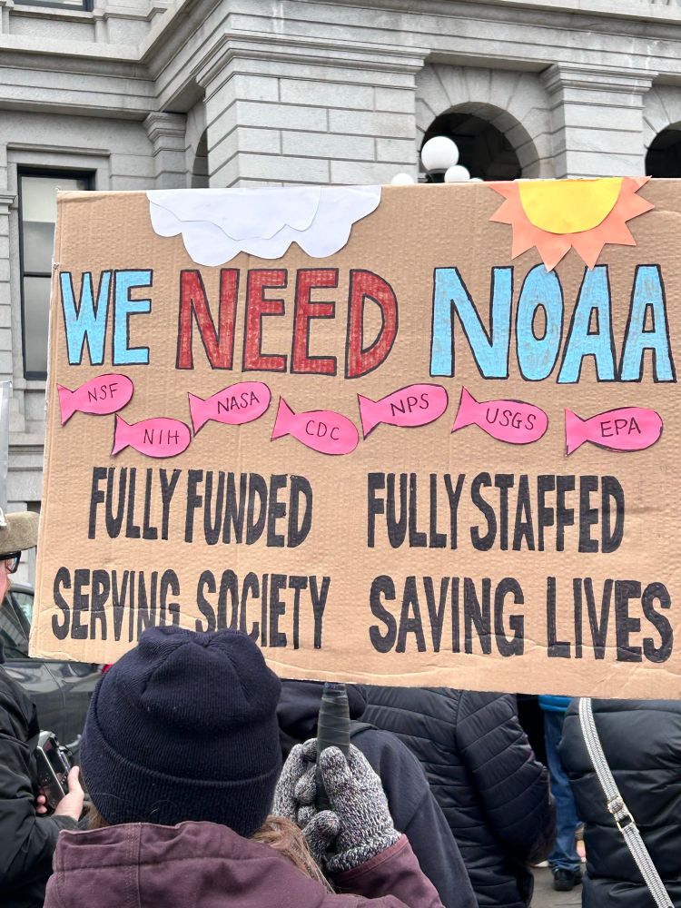 A sign reading We Need NOAA