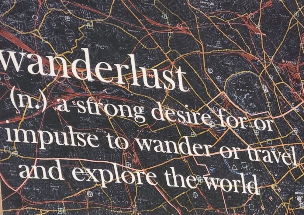  shop wall poster: wanderlust (n) a strong desire for or impulse to wander or travel and explore the world