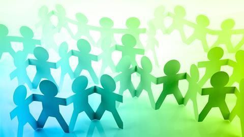 Illustration of paper people holding hands 