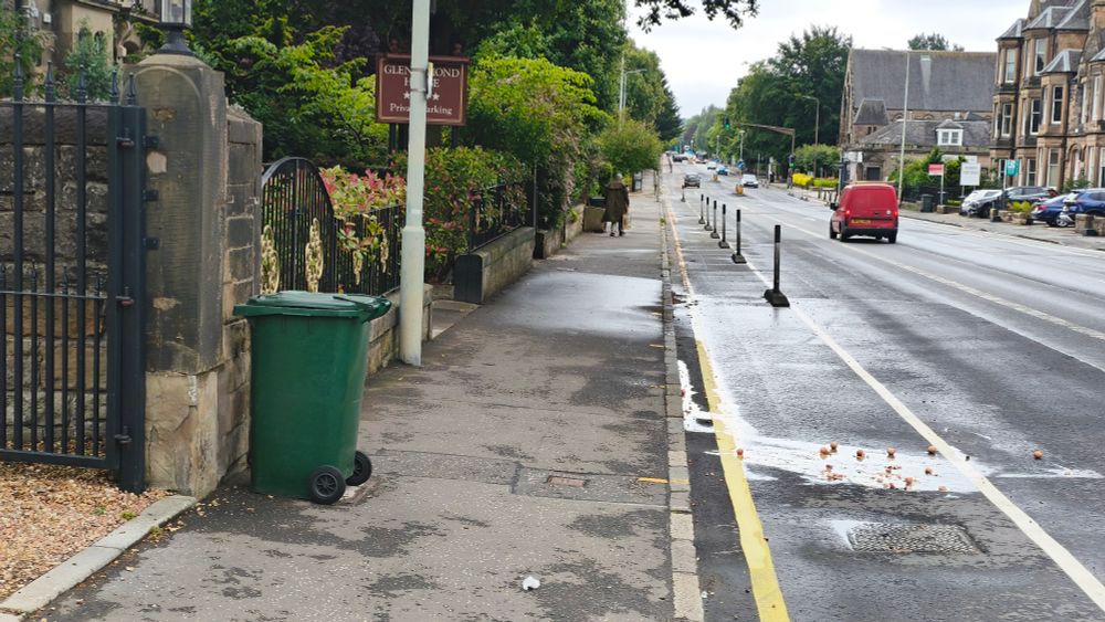 Photo of some eggs smashed on the surface of the cycleway on Newington Road/Mayfield Gardens southbound, looking south/dpwnhill