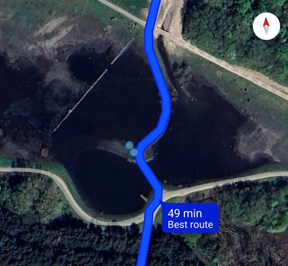 Satellite map image of a suggested route where it goes right through a pond/lake.