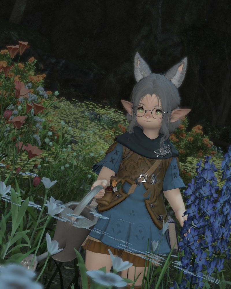A female Lalafell with grey cat ears is watering flowers in Gridania