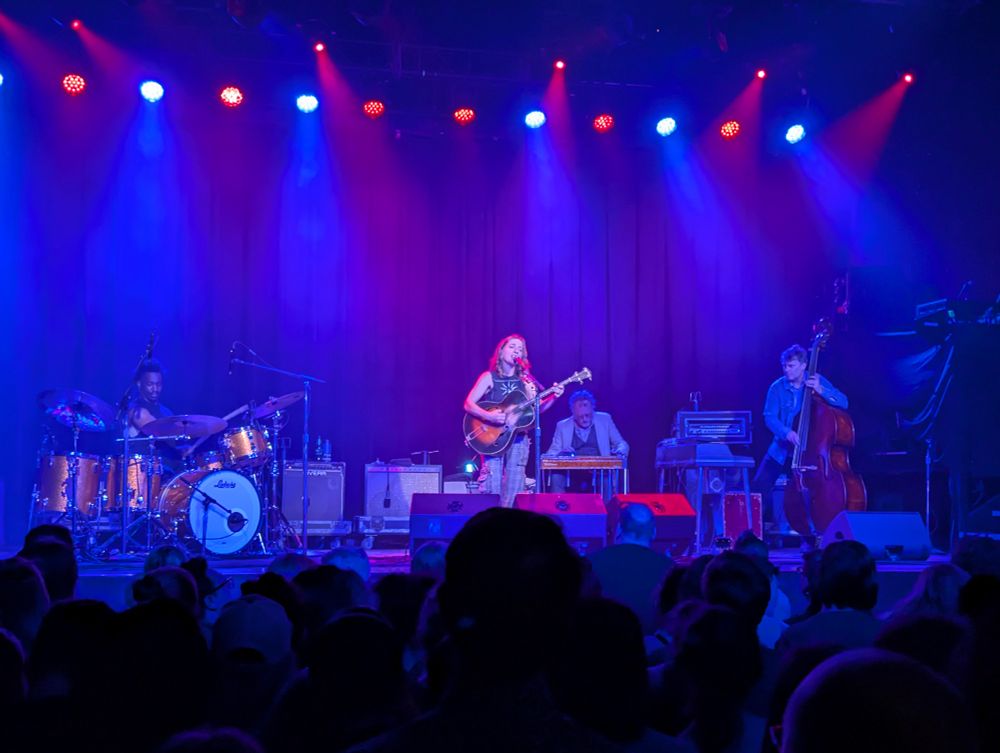 Singer songwriter Ani DeFranco and band performing on stage at First Avenue, Minneapolis. 