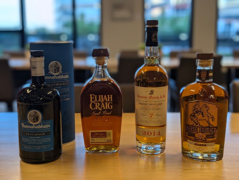 Four bottles of whisky on a table