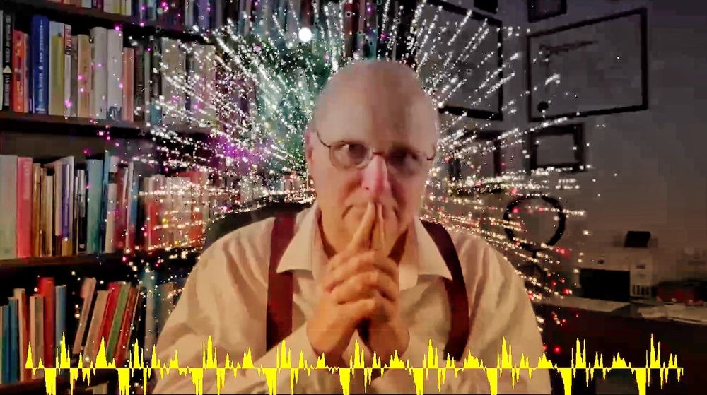 Narrator of the video in pensive pose with fireworks in the background