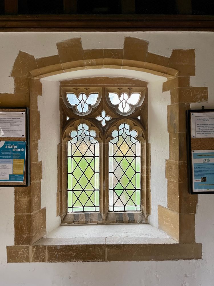 Frosted glass window with cut stone frame 