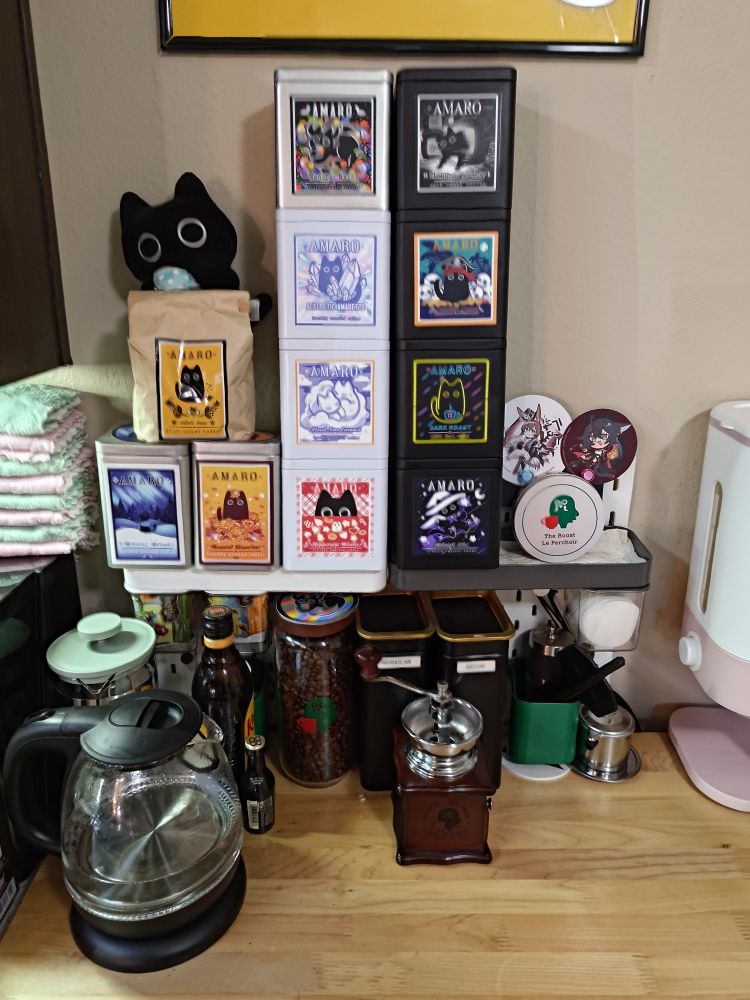 The coffee bar tin stack is now 4 tins high for each tower. There's no room to expand upwards without partially blocking the Cat Nap Cafe art print.