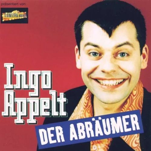 Ein Bild von Ingo Appelt, der sich eine Frisur mit Gabriele Krone-Schmalz teilt. Der Pony ist hierbei eine Art schmaler Pfeil, der Richtung Nase zeigt. 
