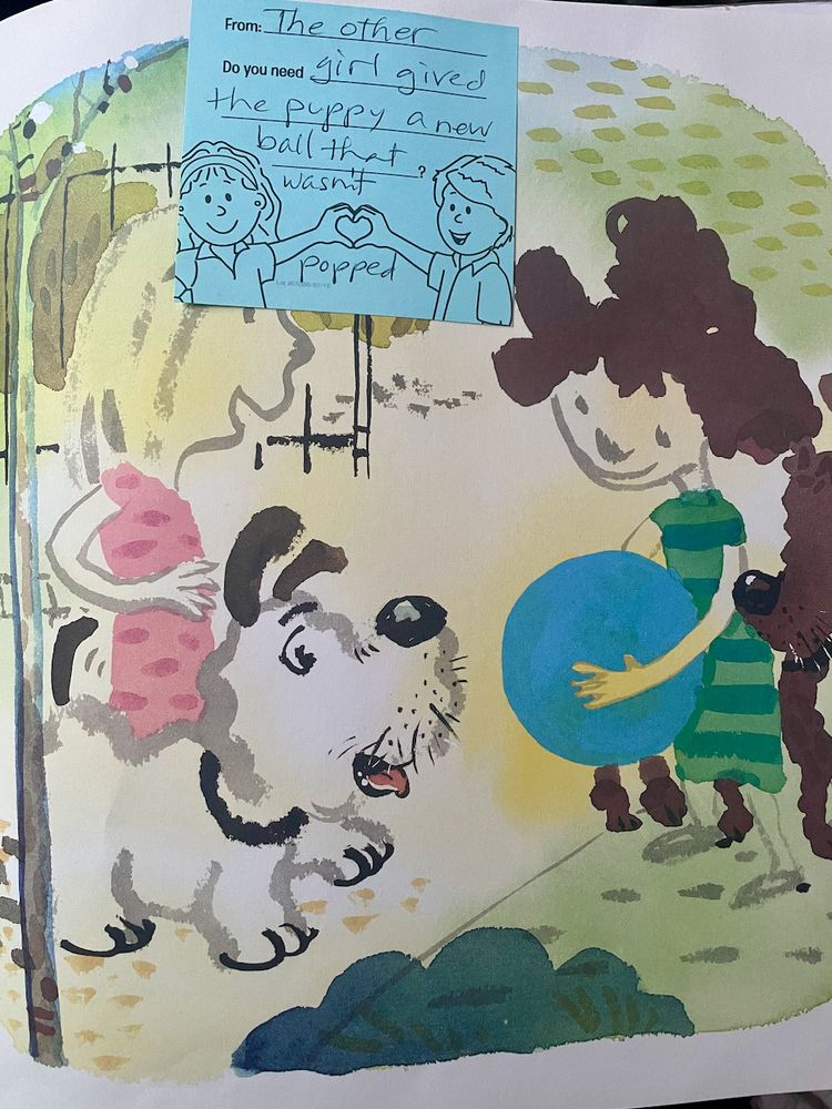 page from A Ball for Daisy with a handwritten note that says "The other girl gived the puppy a new ball that wasn't popped" 