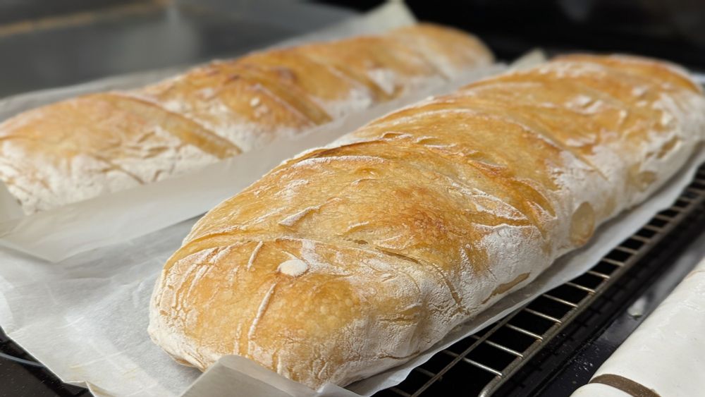 Two long loaves of sourdough bread, handmade by Seer himself!