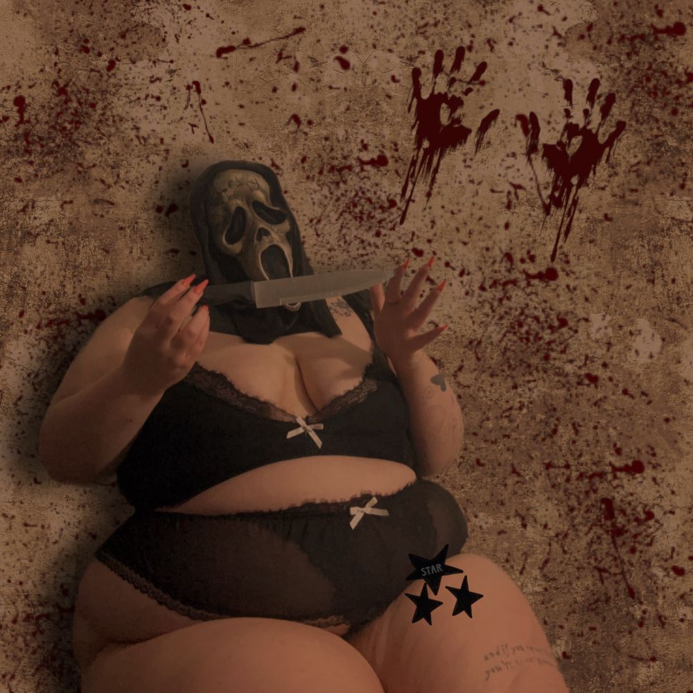 star in a black two piece set and a ghostface mask holding a knife between her hands 