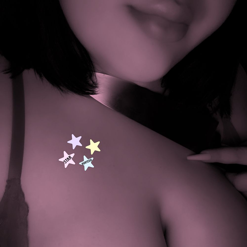 stars lips with a knife to her throat and a bit of cleavage is shown