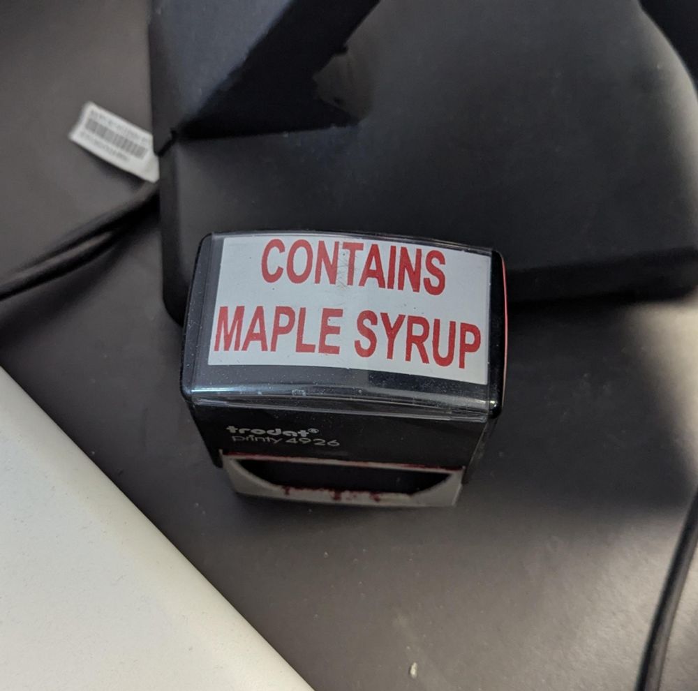 A stamp labeled CONTAINS MAPLE SYRUP 