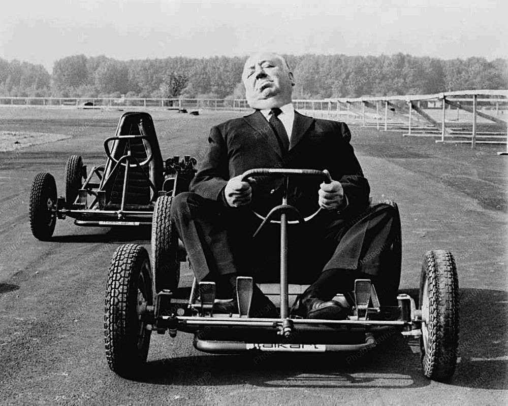 Alfred Hitchcock at the wheel of a go-kart. 