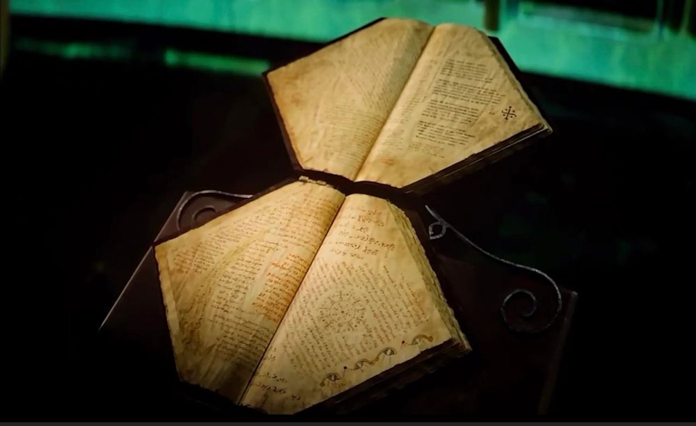 The spellbook from Wicked, called the Grimmerie, open.