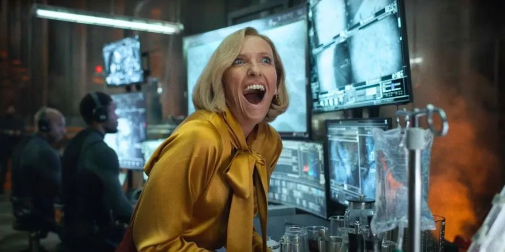Source: Toni Collete in Mickey 17 (2025)

Image: A woman stands in front of a series of monitors and screams in joy
