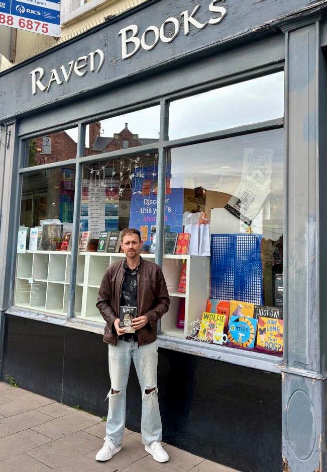 David outside the bookshop