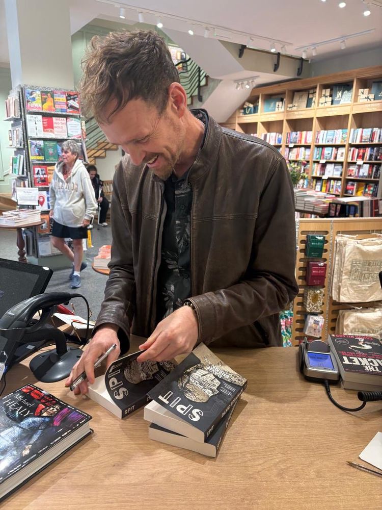 David signing his book 