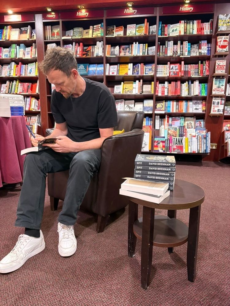 David signing copies of his novel 