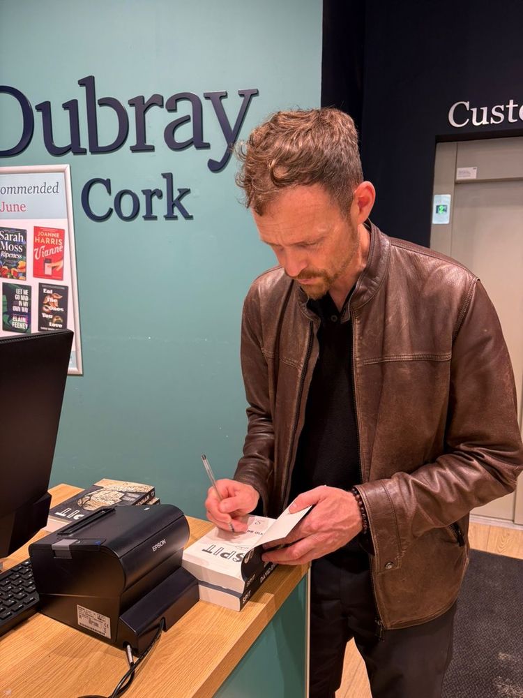 David signing his book