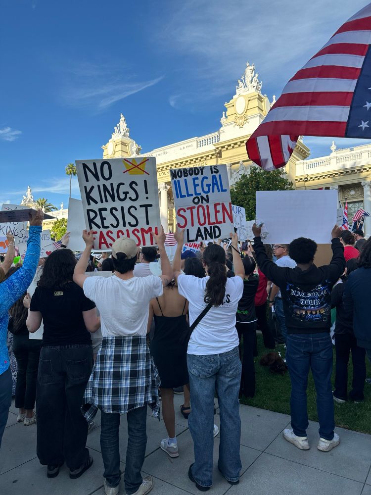 Protesters holding signs in front of courthouse 