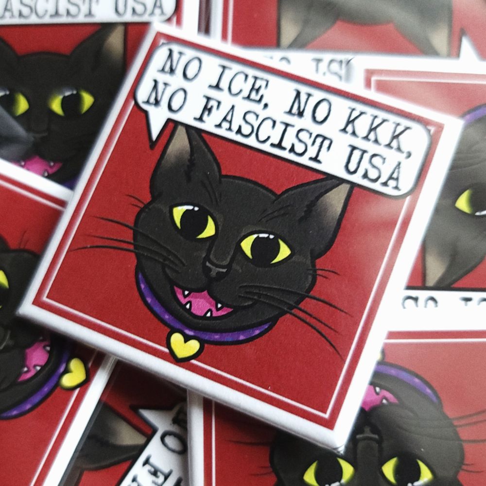 photo of a pile of square pins with a black cat's face, a red background, and a speech bubble saying "NO ICE, NO KKK, NO FASCIST USA." 100% of the proceeds of these will be going to support local activists.