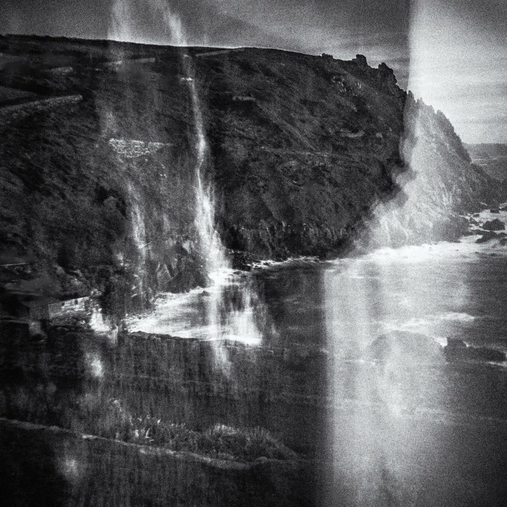 Black-and-white, intentional camera movement image of the north Cornish coast near Cape Cornwall